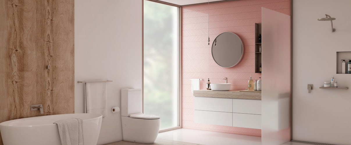 Pink coloured bathroom with chrome tapware and shower and wood highlights