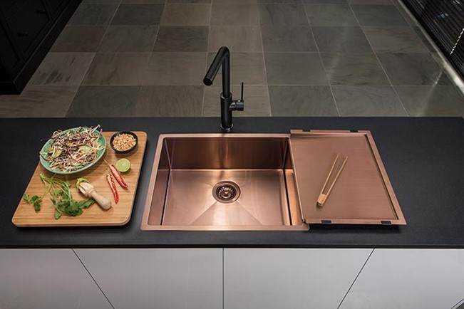 Black Kitchen Mixer with Copper Double Sink on a Black Counter