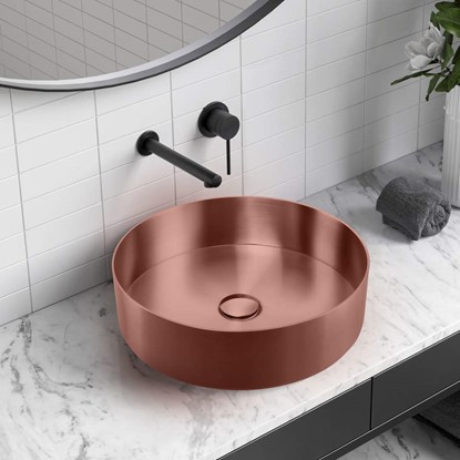 Round Copper Bathroom Basin on a Marble Vanity Top with Black Wall Mounted Mixer