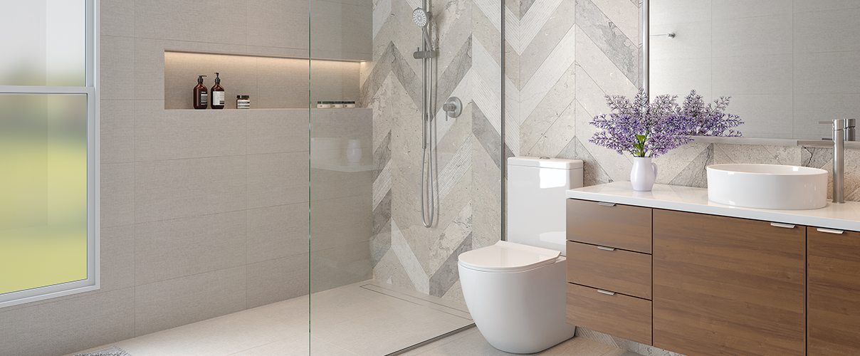 Bathrrom feaureing herringbone tile, a wood vanity with round countertop basin, chrome tapware and a toilet