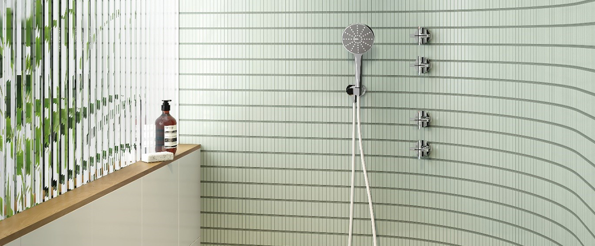 green subway tile bathroom with stainless steel tapware