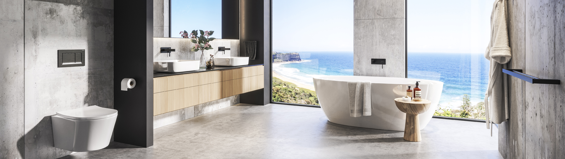 Bathroom with an ocean view, concrete highlights, black tapware and white basins, toilet and freestanding bath