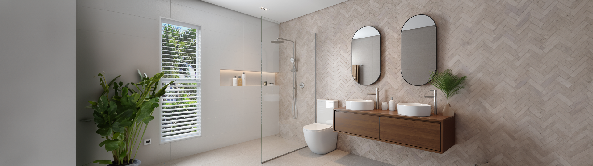Neutral coloured bathroom with herringbone tile feature wall, wood vanity, white basins and clear shower screen with chrome tapware and shower