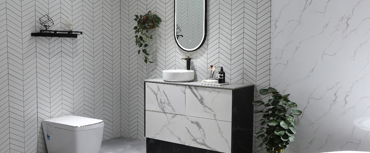 black and white bathroom with white herringbone subway tiles and marble accents, chrome tapware and rimless toilet