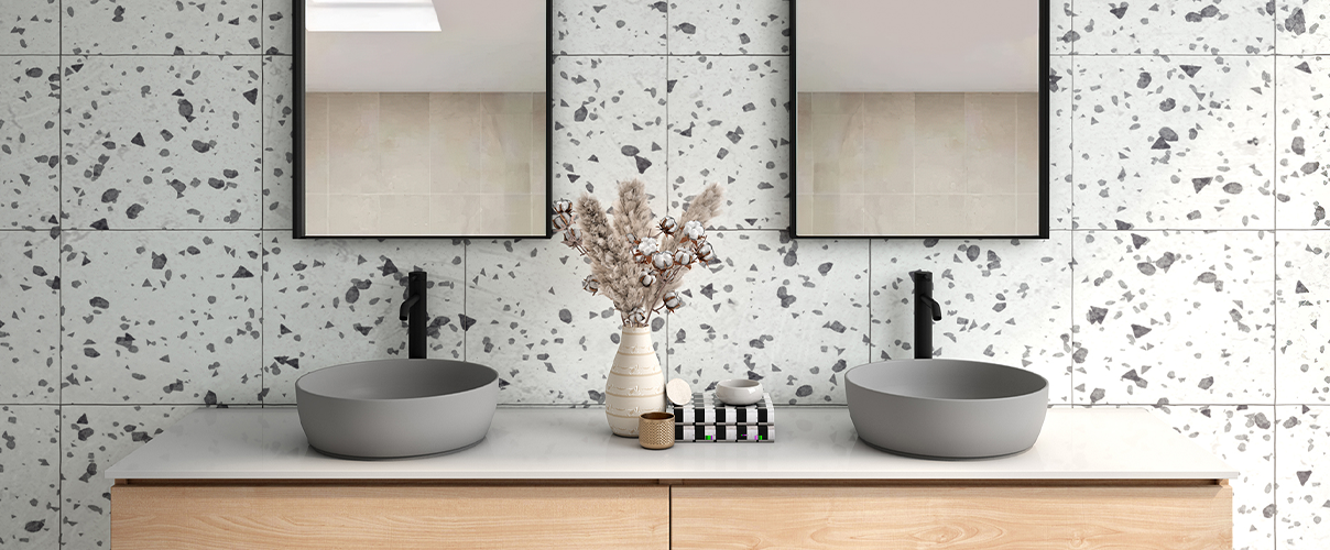 Marble effect bathroom wall with wood vanity and grey basins with black tapware